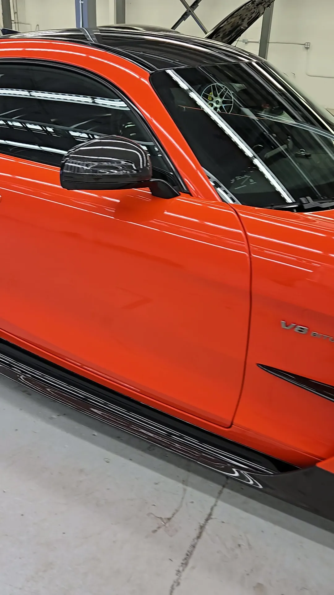 Orange Mercedes-AMG GT Black Series side profile in the Skyline Wraps studio