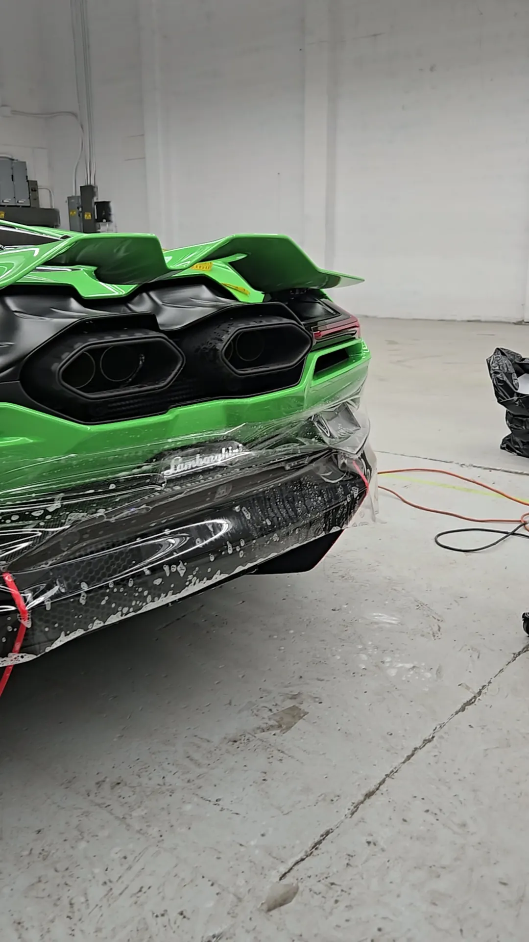 Green Lamborghini Revuelto rear bumper and exhausts in the Skyline Wraps studio