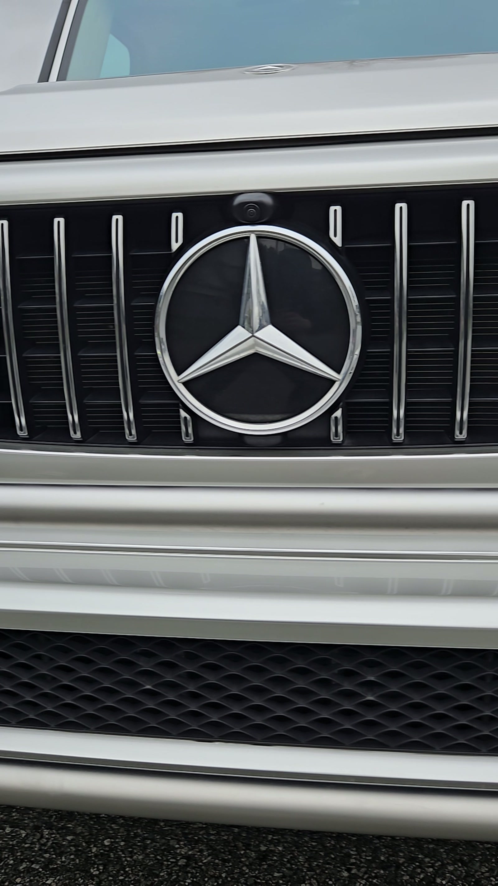 Gloss vinyl wrap detail on a Mercedes-Benz grille
